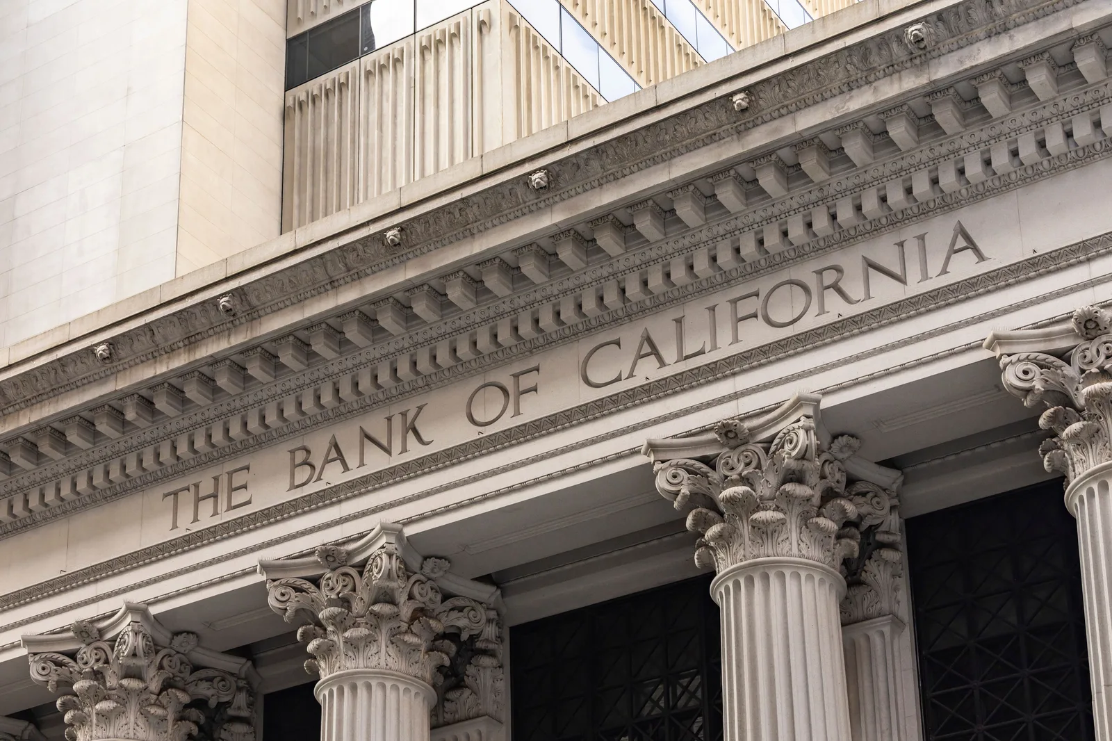Close-up of Bank of California with classic architecture and columns. Alternatives to emailing bank details: portals, calls and holds