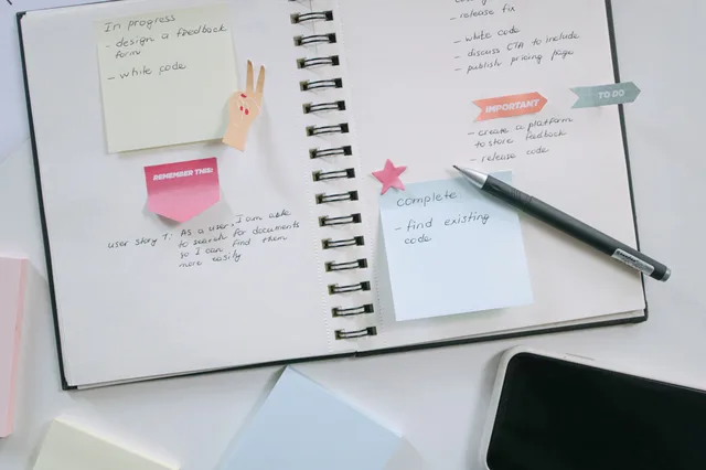 A modern workspace with a notebook, smartphone, and sticky notes emphasizing productivity and organization. Understanding incident response alternatives properly